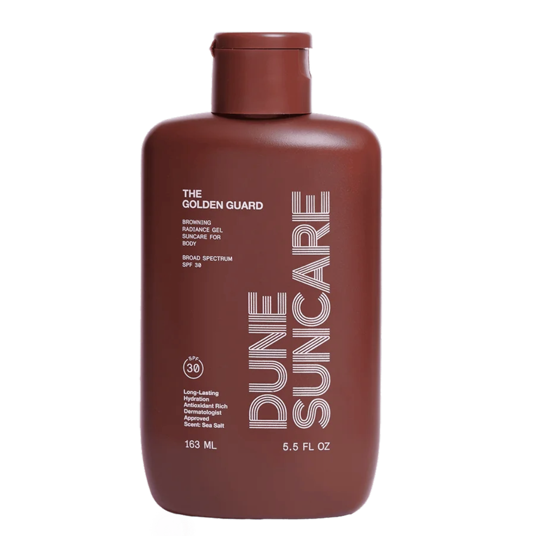 A brown bottle of Dune Suncare The Golden Guard sunscreen gel with white and silver text detailing the product name and benefits.
