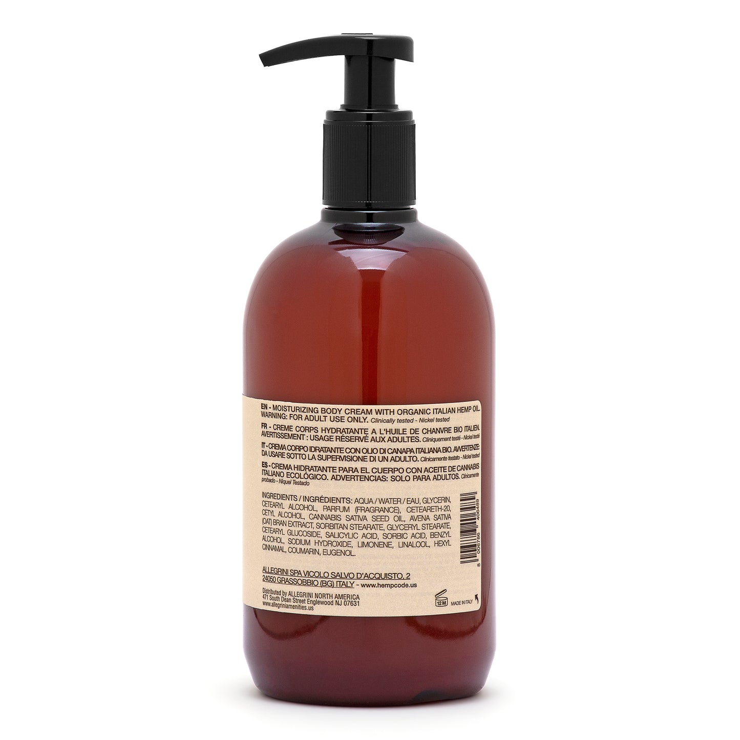 The back of a pump bottle of Body Cream's care label with a brown tinted liquid visible through the bottle.