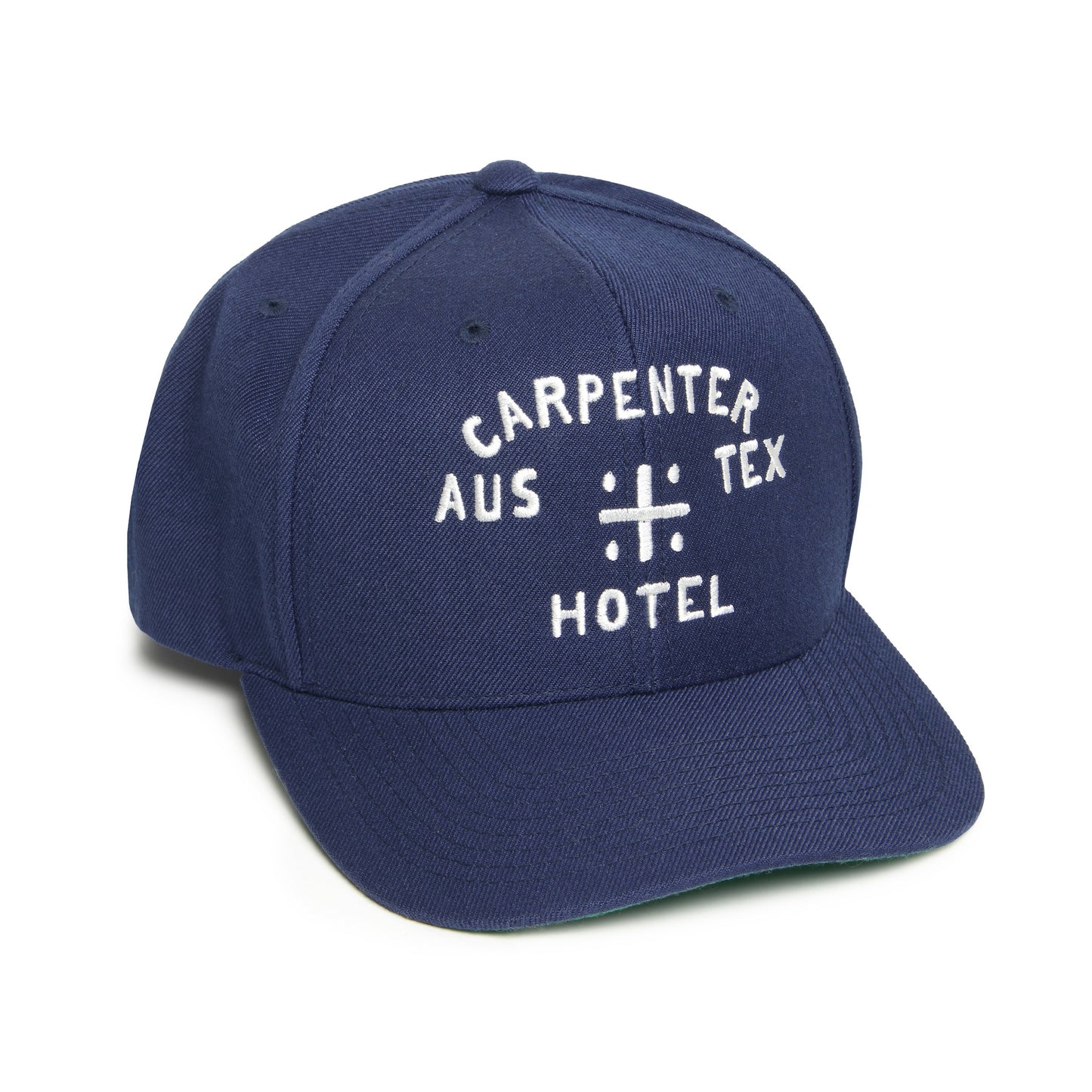 A blue snapback cap with white text 'CARPENTER AUS TEX HOTEL' on the front.