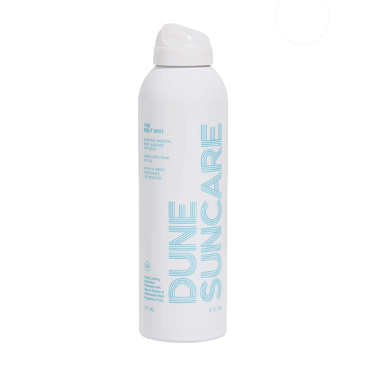 Dune Suncare spray bottle on a white background