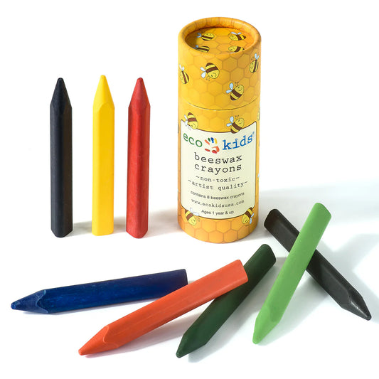 A set of vibrant Eco Kids beeswax crayons displayed next to a reusable cardboard tube with the product name visible.