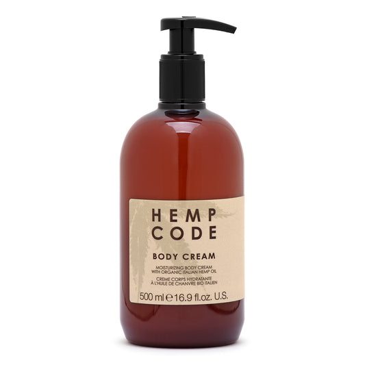 A pump bottle of Body Cream labeled HEMP CODE with a brown tinted liquid visible through the bottle.