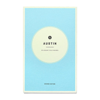A blue book cover with the title 'Austin Wildsam Field Guide' written on it.