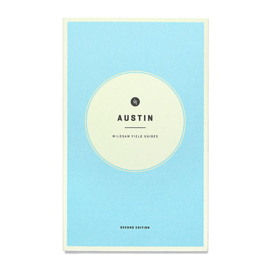 A blue book cover with the title 'Austin Wildsam Field Guide' written on it.